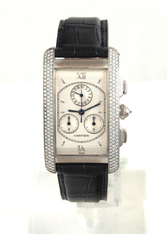 Brand Name: Cartier
Style Number: WB704251
Also Called: Cronoflex, W26033
Series: Tank Americaine Chronoflex Chronograph
Gender: Gents
Case Material: White
Dial Color: Silver w/ Guilloche
Movement: Electro-mechanical
Functions: Hours,