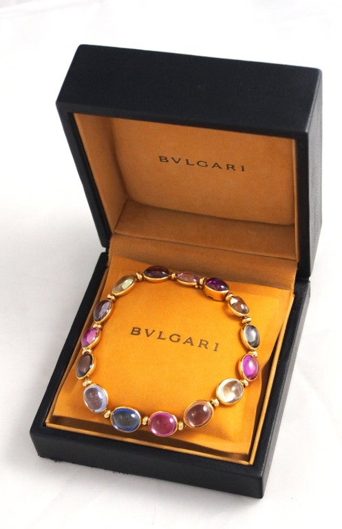 Brand Name: Bulgari

Style: Bracelet

Gender: Lady's

Material: Yellow Gold with Multi-Colored Sapphires

Length: 7 3/8 inches / 18.8cm

Weight: 21.2 g