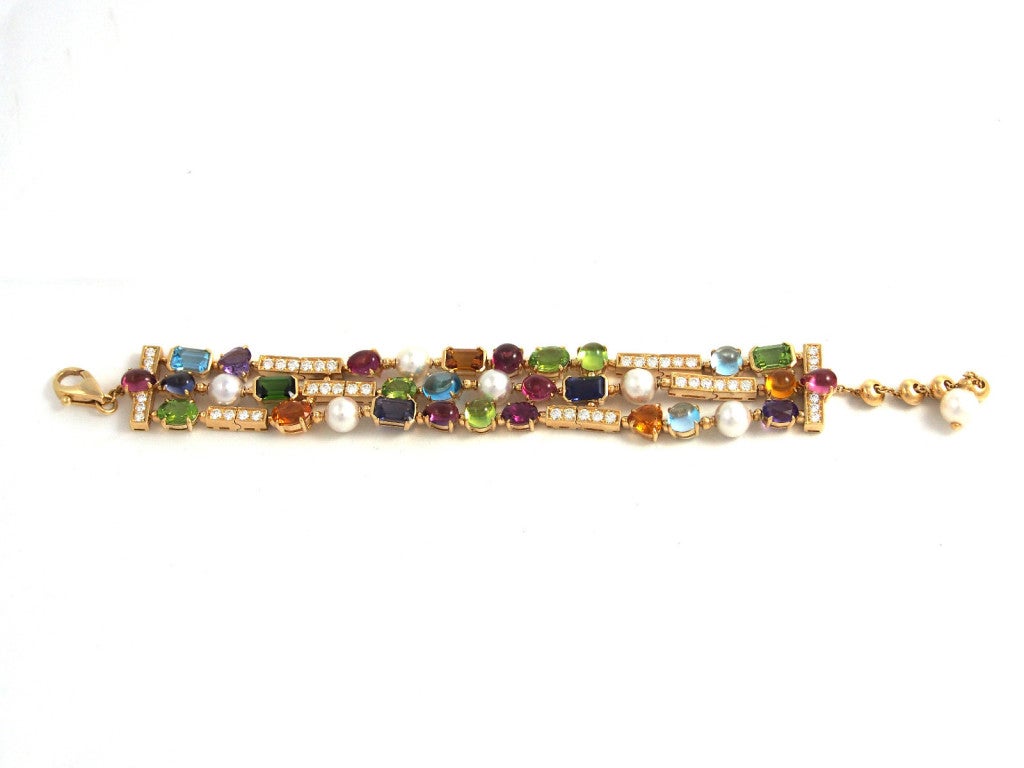 Brand Name: Bulgari

Style Number: BR852005

Series: Color Collection

Gender: Lady's

Case Material: 18K Yellow Gold

Stones: Pink and green tourmalines, peridots, iolites, amethysts, citrine quartz, blue topazes, Akoya cultured pearls
