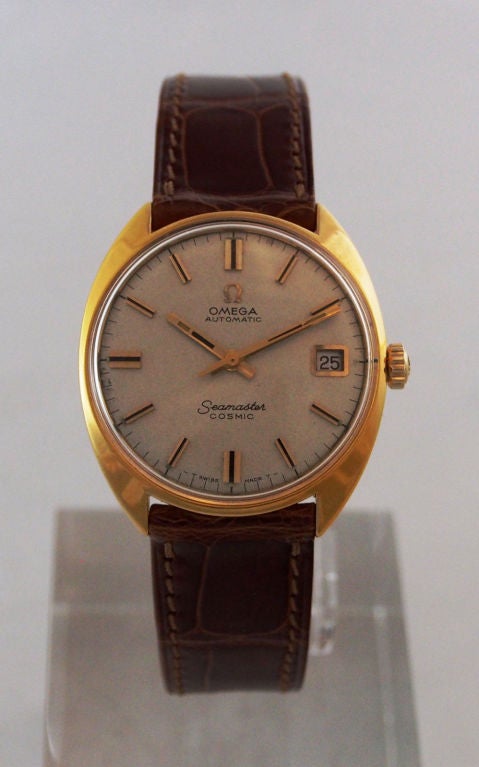 Brand Name: Omega
Style Number: 166023-Tool 105
Series: Seamaster Cosmic
Gender: Men's
Case Material: Gilt Metal
Dial Color: Silver with Gold Hour Markers
Movement: Automatic
Functions: Hours, Minutes, Seconds, Date
Crystal Material: