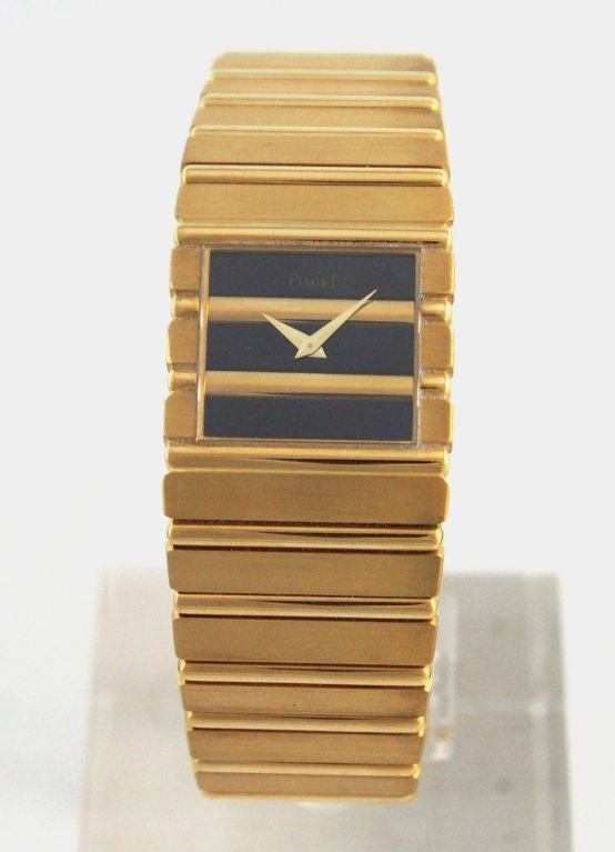 Brand Name: Piaget
Style Number: 7131 G 701
Series: Polo
Gender: Lady's
Case Material: 18k Yellow Gold
Dial Color: Black with Yellow Gold Bars
Movement: Quartz
Case Width: 25mm
Functions: Hours, Minutes
Crystal Material: Scratch Resistant
