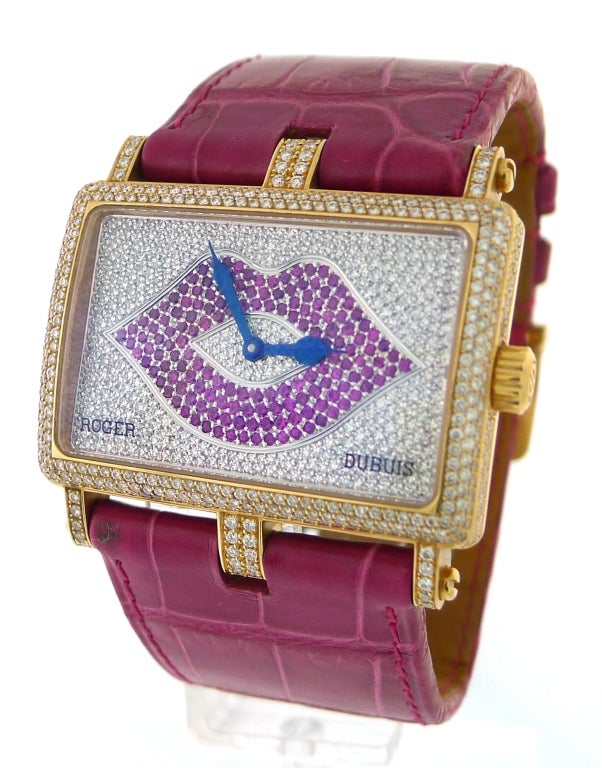 BRAND NAME: 	  	Roger Dubuis
STYLE NUMBER: 	  	T26865-FFD23RD/SM
SERIES: 	  	Too Much
CASE MATERIAL: 	  	Rose Gold Set With Diamonds
DIAL COLOR: 	  	Pave Diamonds and Rubies
MOVEMENT: 	  	Quartz
FUNCTIONS: 	  	Hours, Minutes
CRYSTAL MATERIAL: