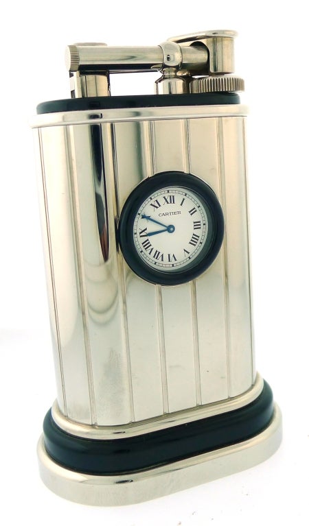 Brand Name: 	  	Cartier<br />
Series: 	  	Table Lighter (Limited Edition of 1000 Pieces)<br />
Clock: Quartz Movement<br />
Metal: Platinum Finish & Black Lacquer
