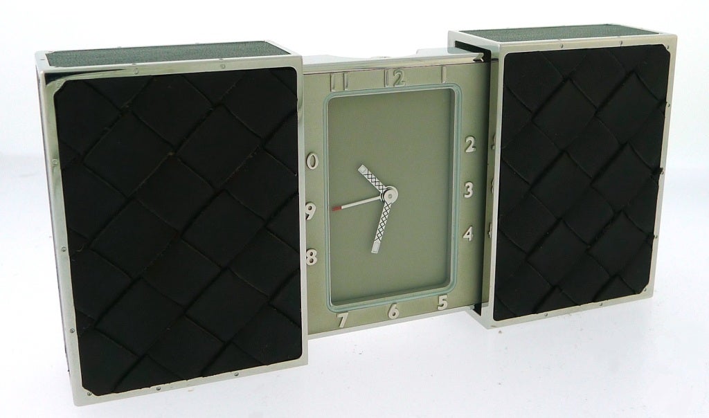 Brand Name: 	  	Bottega Veneta<br />
Series: 	  	Intrecciato Travel Clock<br />
Dial Color: 	  	Taupe<br />
Case Material: 	  	Steel wrapped in Intrecciato Leather<br />
Movement: 	  	Quartz<br />
Functions: 	  	Alarm<br />
Crystal Material: 	