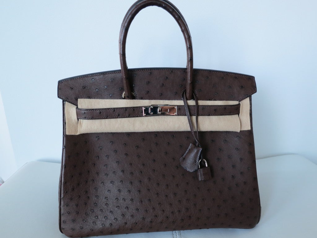 Truly a dream come true... Gorgeous, understated and beautiful. The simplicity of Ostrich is rich and chic. The brown tones are beyond magnificent and the palladium hardware compliments the color even more. Pre-owned but in perfect condition. 
Bag