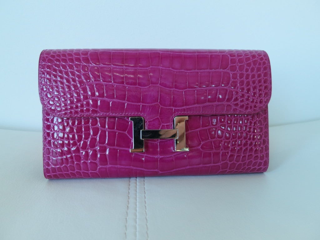 Fabulous Hermes Alligator Constance Wallet in Rose Sheherazade with PHW.
This wallet could be used as a clutch as well. Back pocket and plenty of room for the essentials. The color is magnificant, light weight for wallet purposes and a brilliant