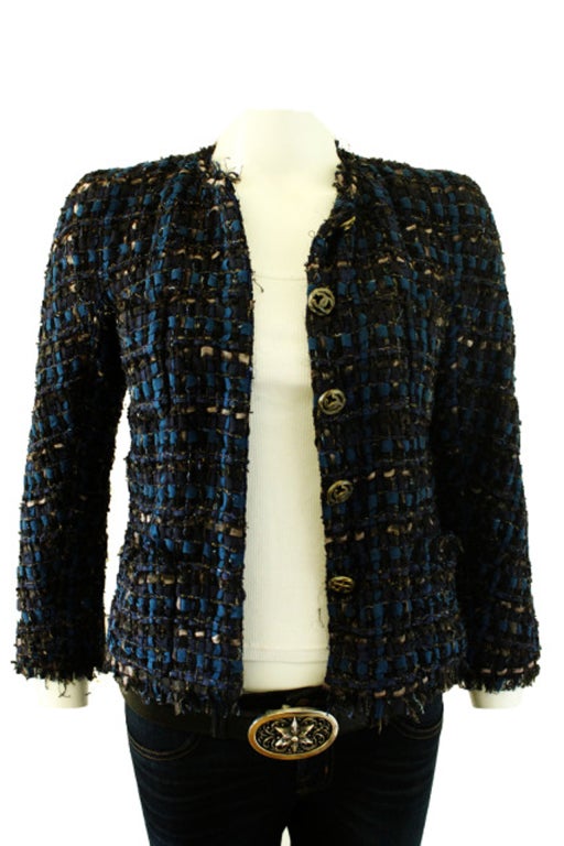 This Chanel Ribbon style jacket is the perfect understated jacket to partner up with a pair of jeans for the alternative to black. The different shades of blue,marine and a touch of taupe is the easiest jacket to accessorize with anything. The 5 gun