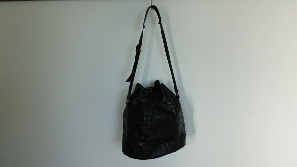 The classic bucket bag.... This vintage Nancy Heller bag is show stopper, it has it's own look and lightweight so it's easy to wear. The red interior gives that vintage feel.<br />
Perfect bag to grab and go anywhere...........<br />
Contact
