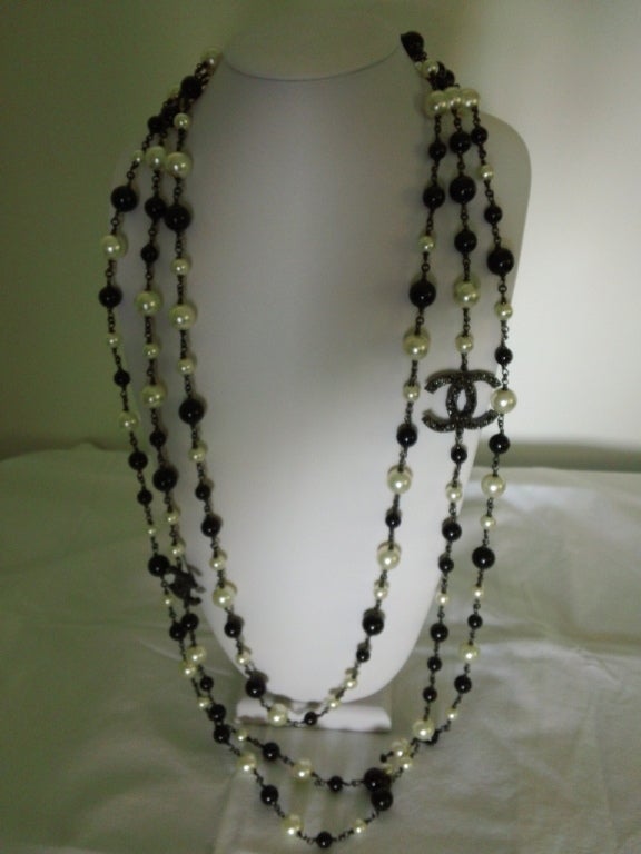 Chanel's chic and elegant 3 strand Faux pearls in black and white with the CC accents. This necklace was shown in the 2011 Spring Collection Chanel book.
Contact dealer for measurements.