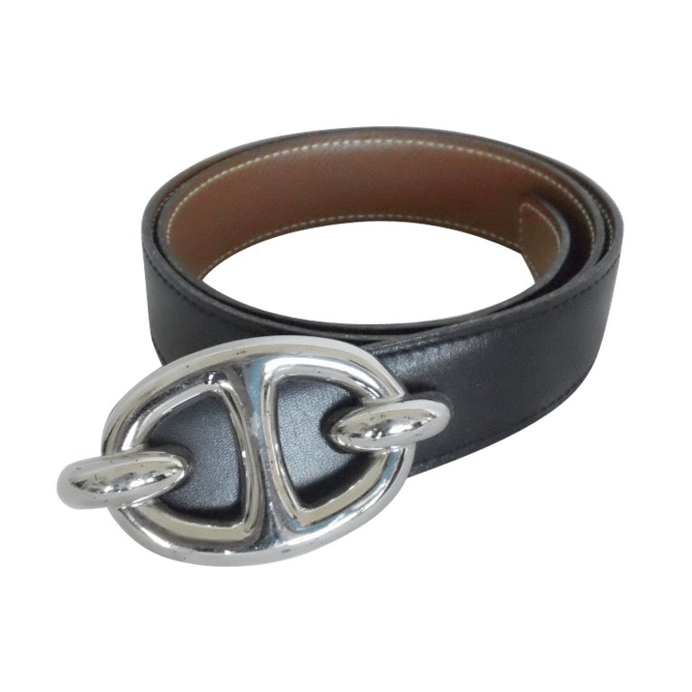 The Hermes belt with silver equestrian  buckle and reversible black and tan strap. A chic and classic basic for your wardrobe.
Contact dealer for measurements.