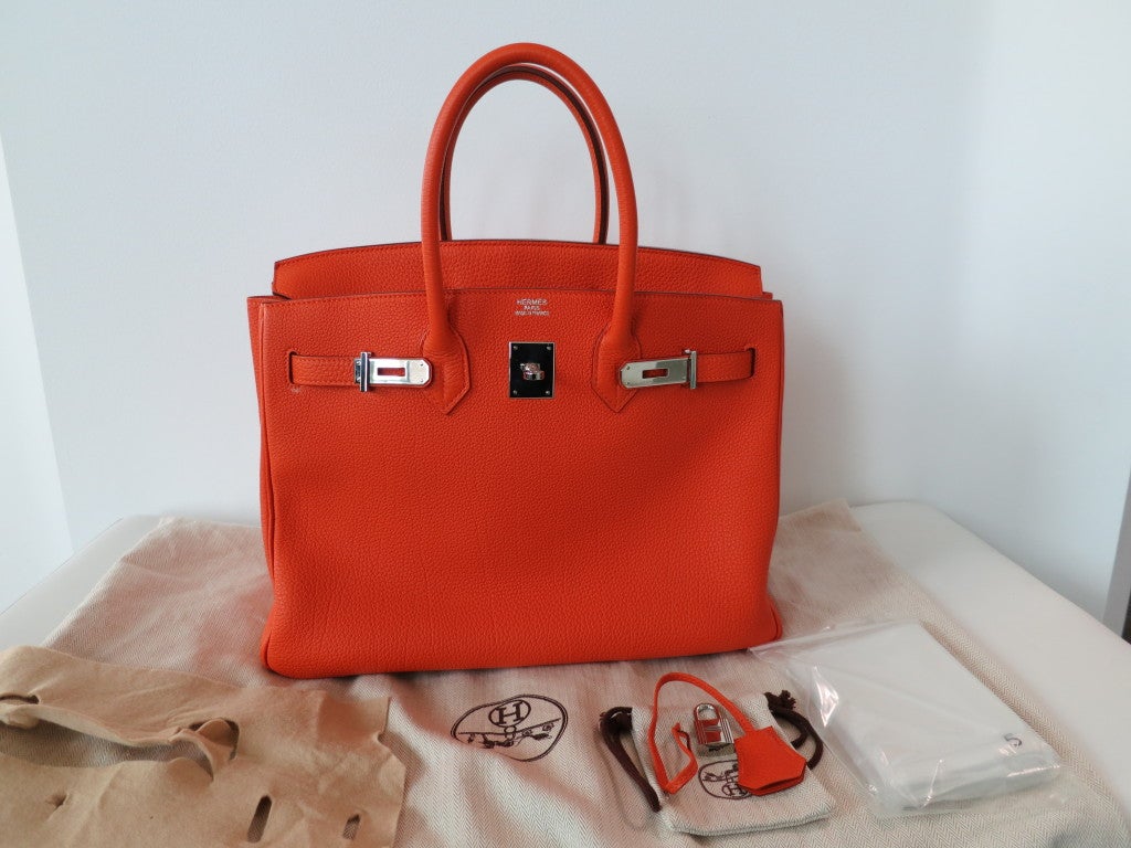 Hermes classic Birkin bag in Orange with PHW. There's not much more to say, the bag say's it all. Chic and luxurious. This bag is in perfect like new condition worn only a couple of times. Box included.
