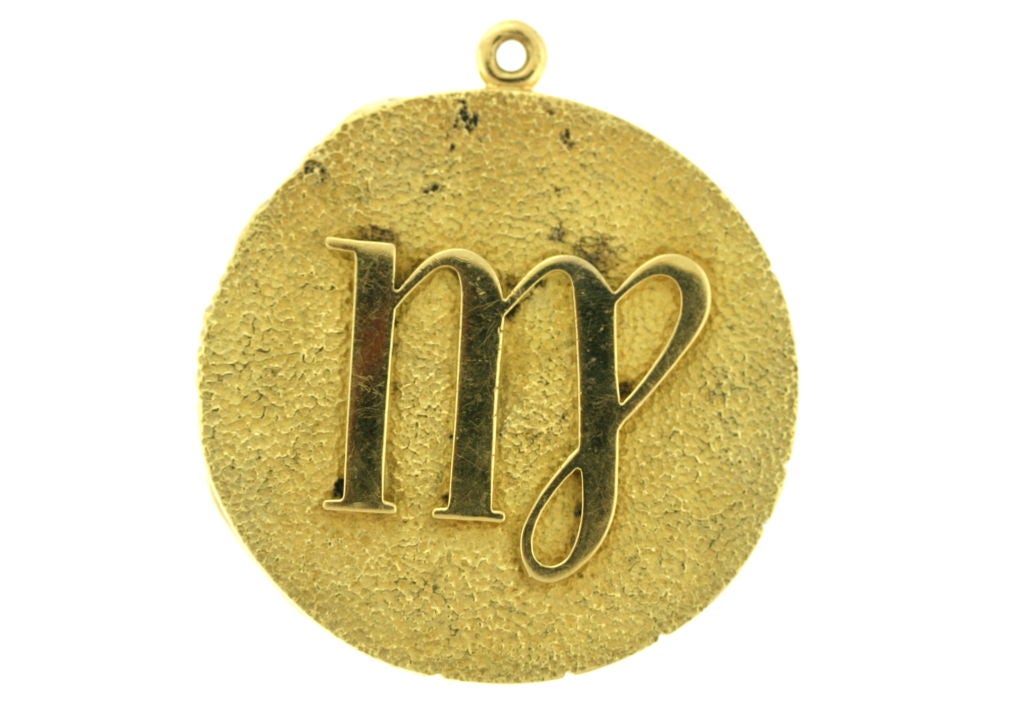 From the Tiffany Zodiac collection of the 1970s this medallion bears the symbol for Virgo (August 23-Septeber 23). The 18k yellow gold pendant measures 1.75