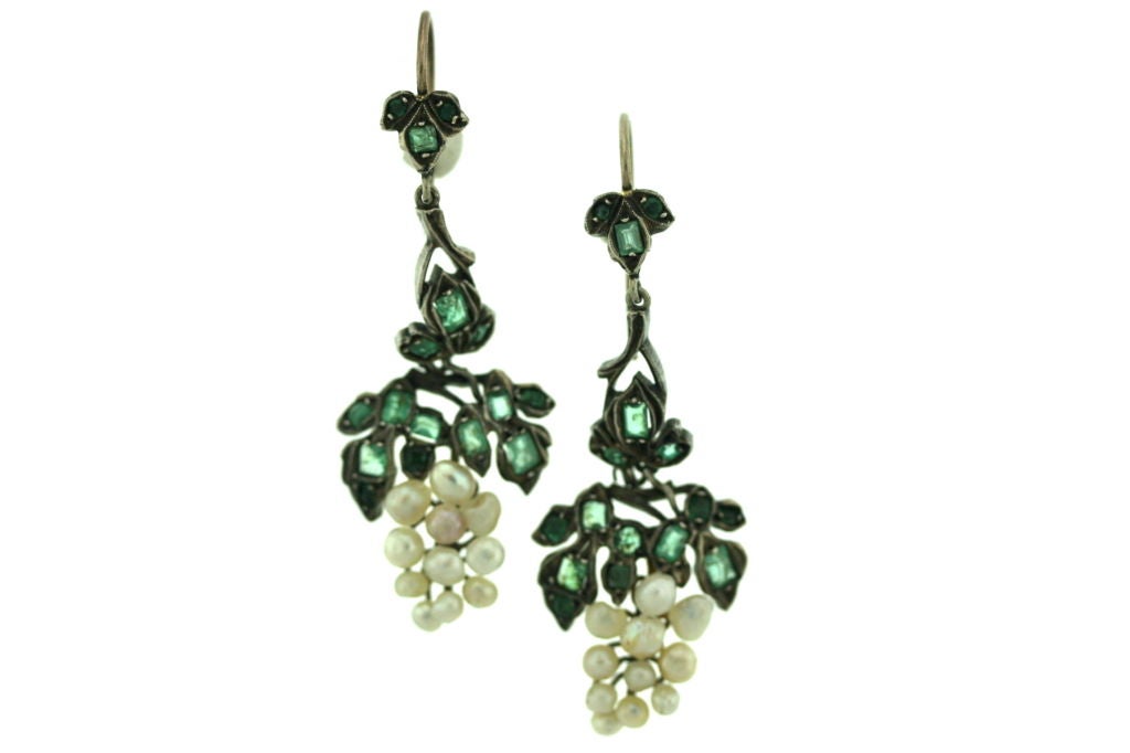 A beautiful and whimsical pair of Victorian ear pendants designed as a faceted emerald and pearl 
