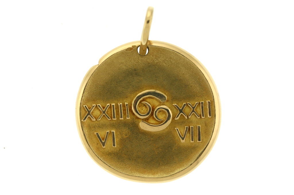 A jumbo sized 18k gold Cancer zodiac medallion in the style of an ancient coin. 1 5/8' in diameter. Signed VCA 119605 with French hallmarks present.