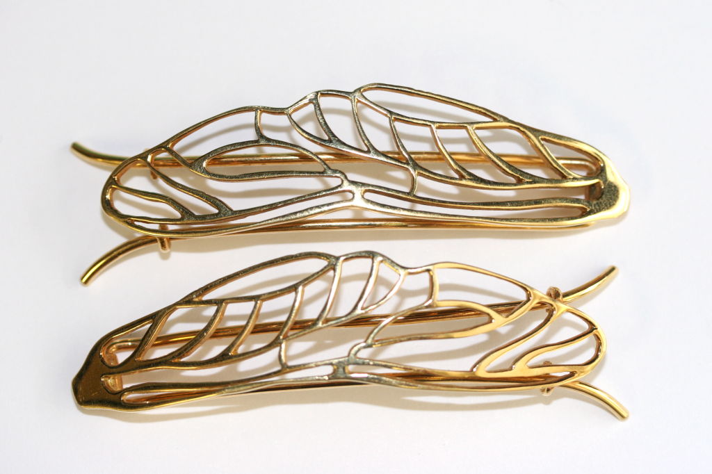 Pair of 18k gold hair clips designed by Angela Cummings for Tiffany & Co circa 1981. The open work style of the clips is of a naturalistic form and speaks to the type of work Cummings was known best for. The epitome of chic! Each clip measures 2.75