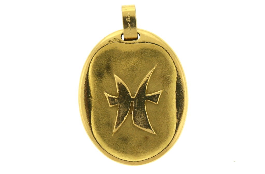 Rare jumbo sized Cartier Paris Pisces zodiac medallion. A wonderful personal piece of jewelry in solid 18k gold. Signed Cartier Paris and numbered.