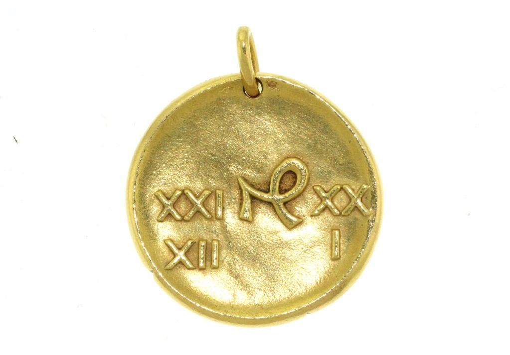 Van Cleef & Arpels 18k gold zodiac pendant designed in the style of an ancient coin with the Capricorn symbol on the front and the Roman numeral dates of the sign on the reverse side. This is the jumbo size and the largest made by Van Cleef in the