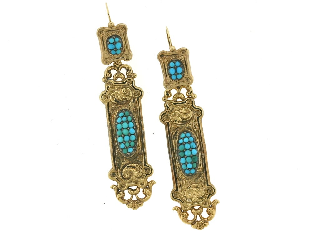 A stunning pair of 15ct gold earrings designed as square tops suspending rectangular bottoms each inset with turquoise surrounded by elegant swirls of gold. In excellent condition, these earrings are quite unusual and are simply divine. 3