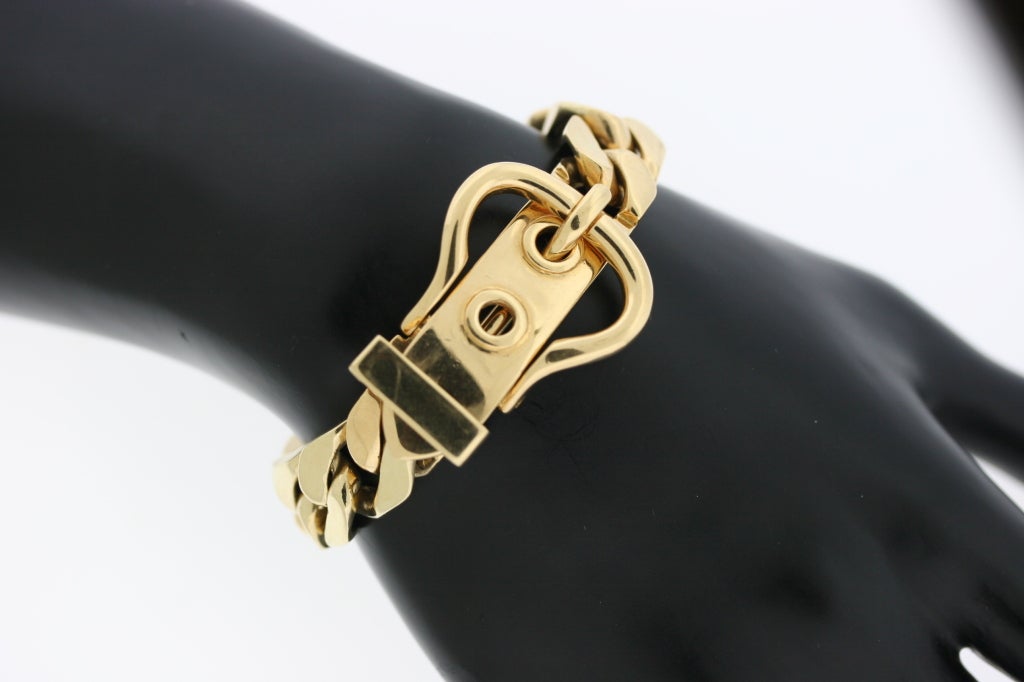 Gucci Italy substantial 18k gold curb link bracelet with a functional buckle closure. This is a classic iconic Gucci design which is perfect for everyday wear. Most definitely a stand alone piece which would also look very stylish paired with