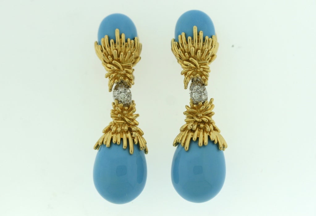 A stunning pair of 18k gold earrings from Kutchinsky designed as a clip on enamel top set in striated gold work with a center diamond joining element suspending a larger enamel and gold bottom. 2