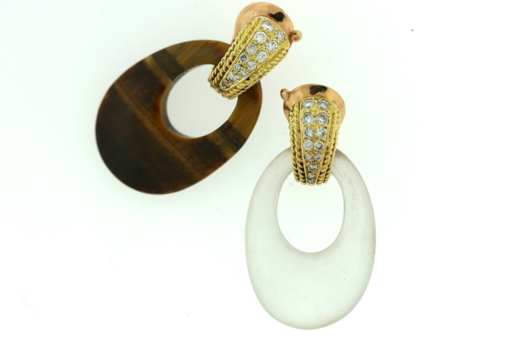 Van Cleef & Arpels interchangeable earrings designed as 18k gold and diamond tops which open to accommodate various hard stone hoops including black onyx, chrysophrase, two variations of rock crystal, genuine turquoise and tiger eye essentially