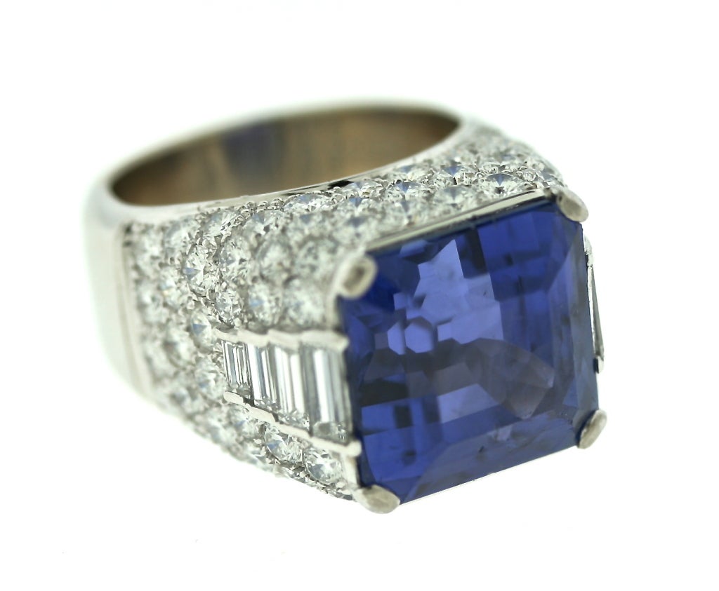 Bulgari 18k white gold and platinum ring centering an 18.55ct Ceylon, no heat, square emerald cut sapphire set in the iconic Bulgari Trombino style. The sapphire is a saturated cornflower blue. The total diamond weight in the setting is