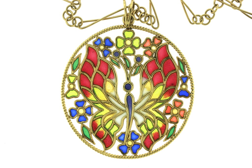 Ugo Piccini 18k twisted gold bordered pendant done in plique-a-jour enamel of a colorful butterfly motif. This is a very vibrant and happy 1970s design and is shown on an 18k gold 32