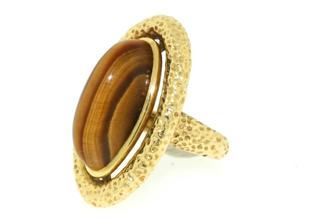 Van Cleef & Arpels richly textured 18k gold oval shaped ring with center tiger eye stone. 1/38