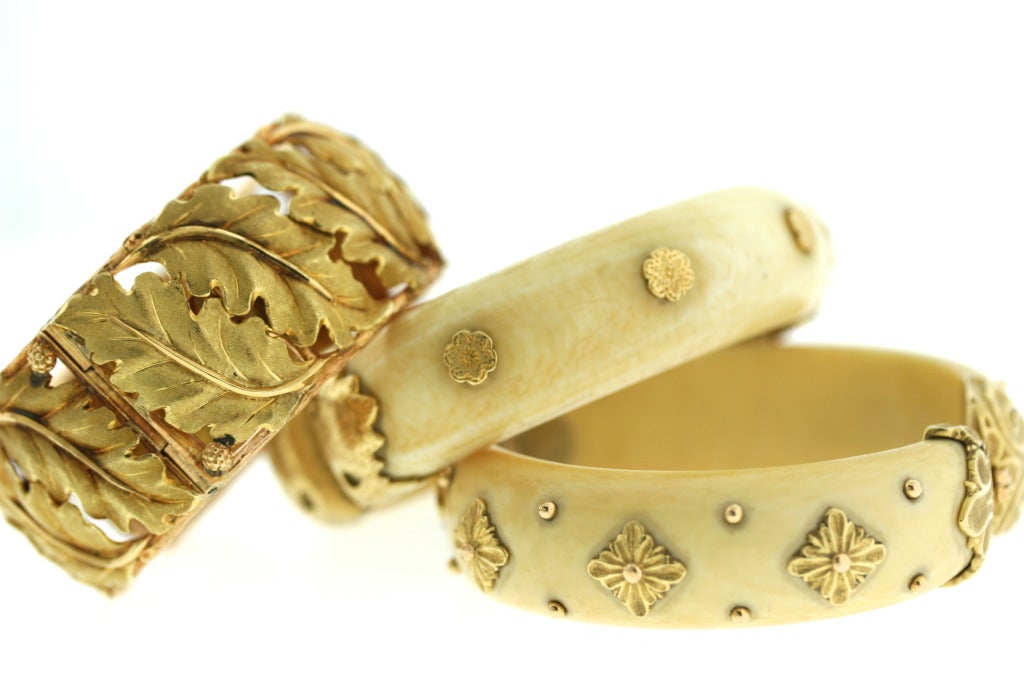 A rare and elegant complementary pair of Buccellati 18k gold and ivory hinged bangle bracelets. Both bangles are hinged and set with 18k gold engraved detailing in true Buccellati fashion. The simplicity of one is the perfect counterpart to the