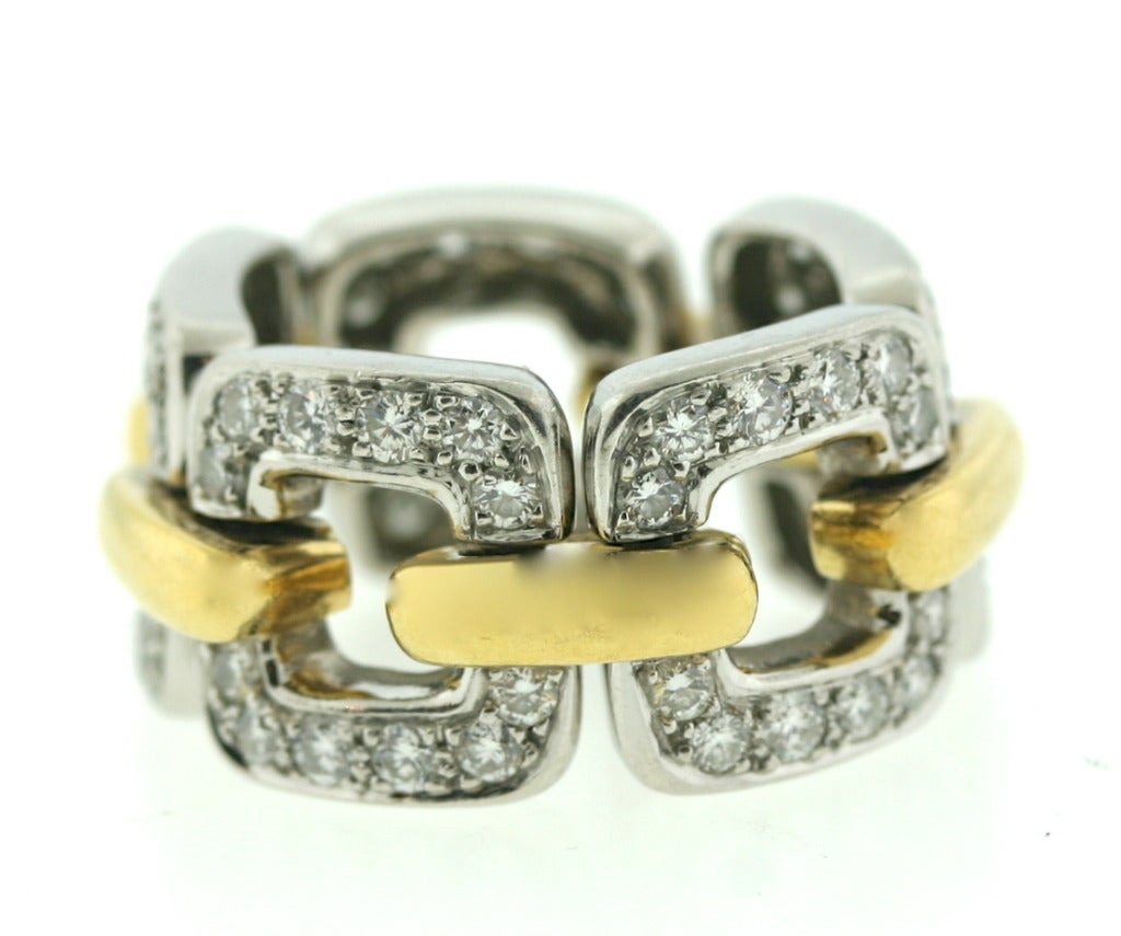 Angela Cummings flexible platinum and diamond band designed as 5 square links joined by 18k yellow gold bridges. Within each link are set 12 diamonds for a total of 60 diamonds with an approximate weight of 3-3.5 cts. Signed CUMMINGS marked PLAT750.