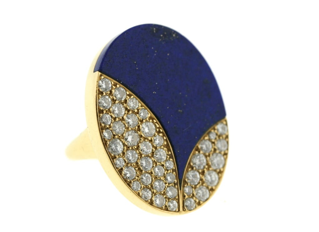 Bulgari 18k gold ring set with lapis and diamonds circa 1970s. This ring relates to the stylish pieces Bulgari produced in this era from the wonderful colored hard stone sautoirs to the cleverly designed tubogas bracelets set with hard stone stars