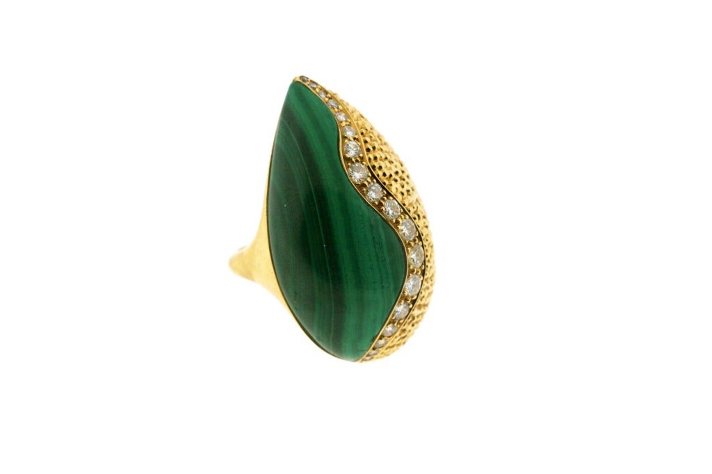 A wavy line of diamonds splits fluid malachite from textured, granulated 18k gold on this bold teardrop ring. Signed Mauboussin with French assay marks. Circa 1970s. Size 7
