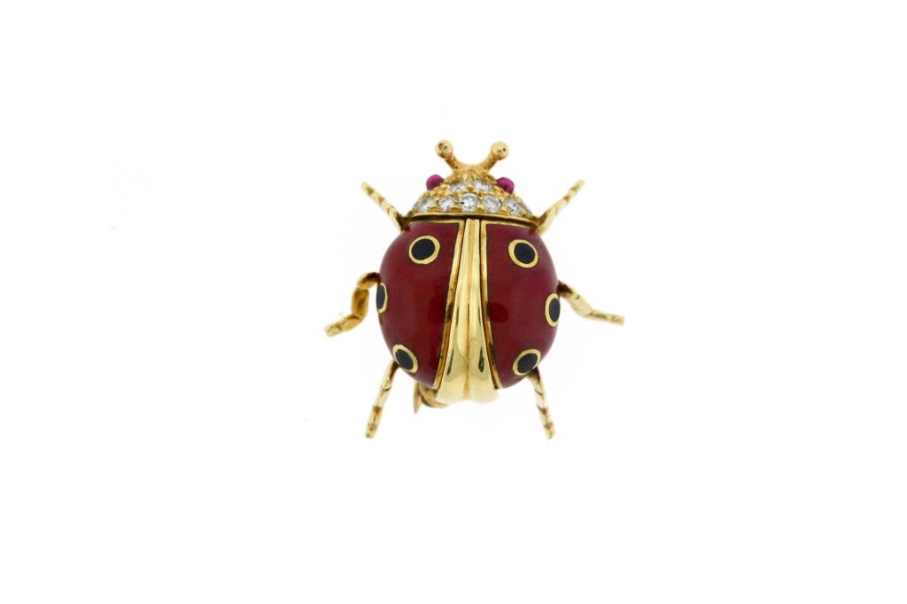 Super-cute and small enamel ladybug pin with a diamond head and ruby eyes.