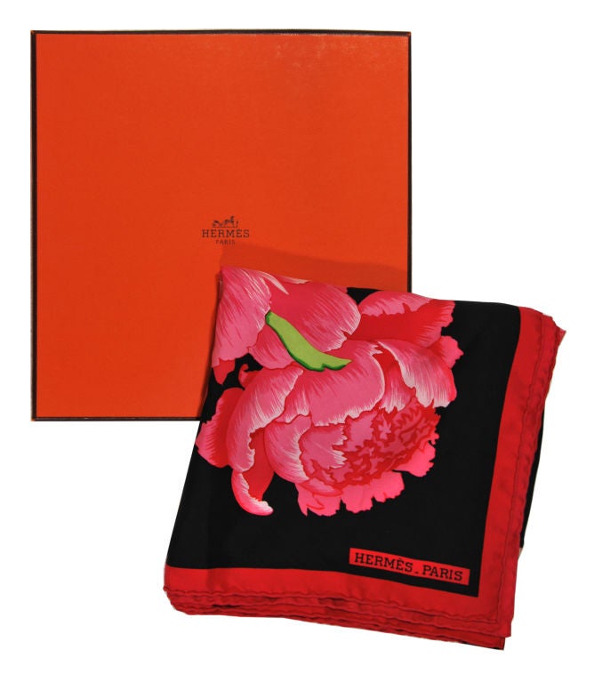 The most beautiful Hermes silk scarf.  Black background with giant Peonies in red and fuschia that just come alive.