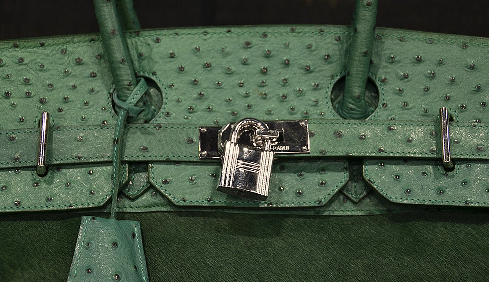 One of a kind, custom order Hermes JPG Birkin bag in emerald green ostrich and fur.  Blind stamp dates year as 2005.  Palladium hardware accents this most magnificent and rare bag.  Previously owned and in excellent condition, however, does not come