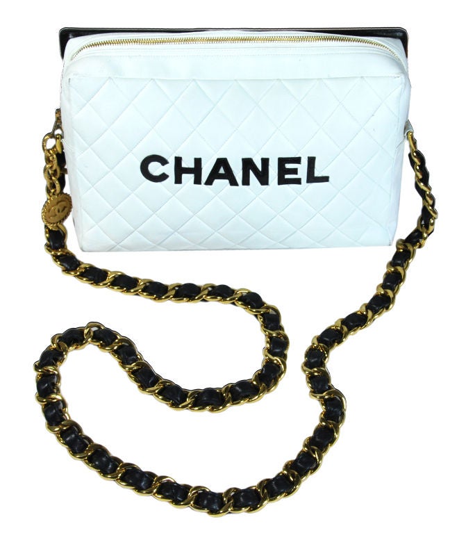 Chanel rare Runway bag, Pre-1985.  In excellent vintage condition.  The white portion of the bag could use a cleaning, but there is NO damage other than that.  

It is truly an amazing one of a kind bag. One side is white with 
