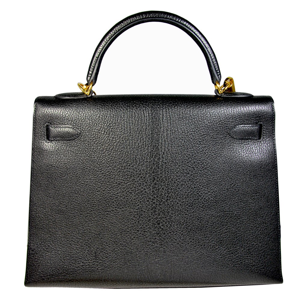 Gorgeous Hermes 32cm Black Chèvre de Coromandel leather Kelly bag, with gold hardware.  Excellent per-owned condition.  Bag comes with lock and key, detachable shoulder strap, dust cover and box.