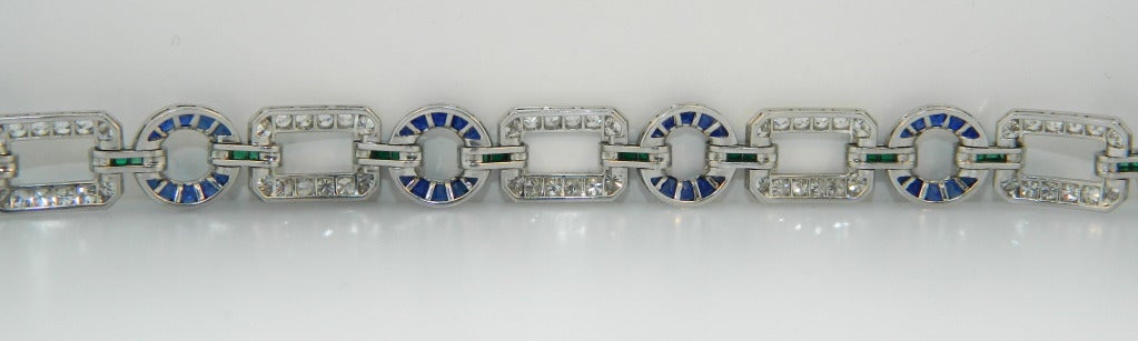 A Wonderful Art Deco Emerald, Diamond, and Sapphire Peacock Bracelet.  Although unsigned, this gorgeous bracelet is possibly by Cartier New York.