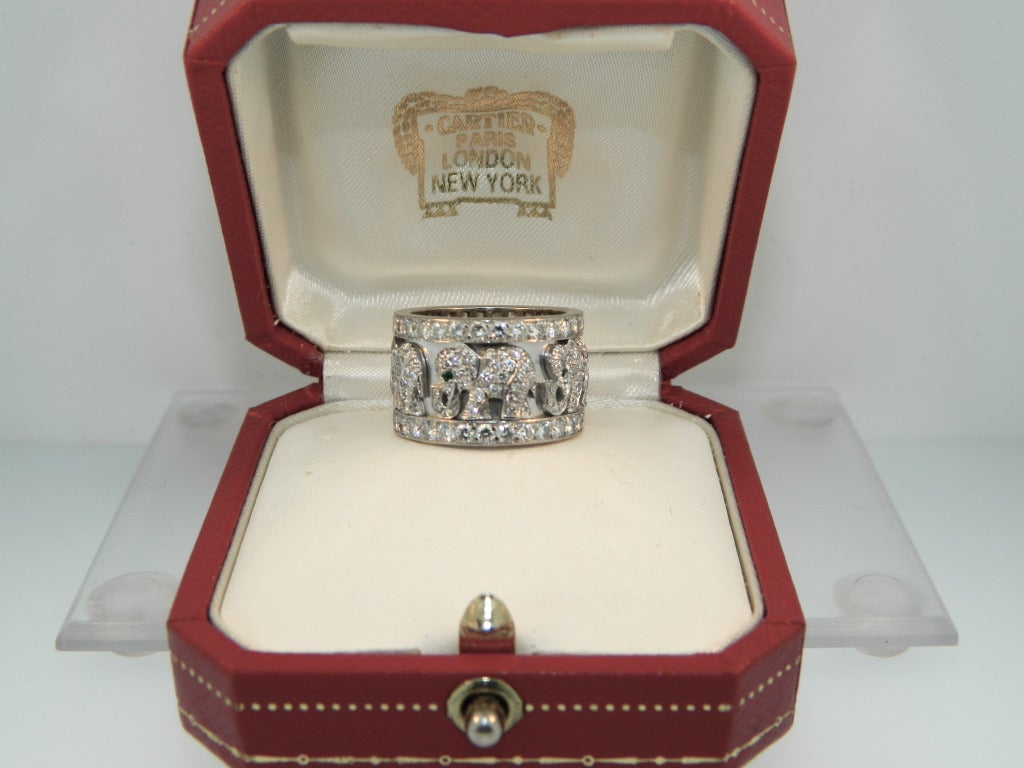 A beautiful Cartier Paris, Diamond, Emerald and White Gold Elephant Ring in it's original box.  Size 52 (6)