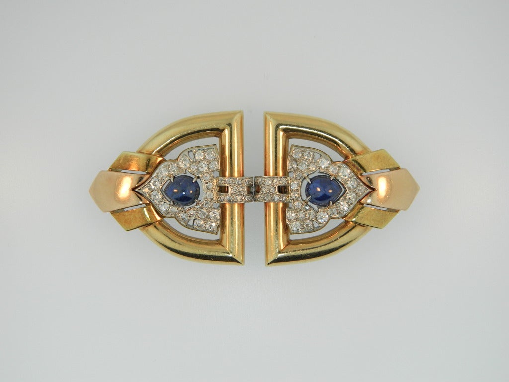 A rare and stunning pair of 1930s Retro, Diamond, Sapphire, Platinum, Rose and yellow gold double clips by Trabert & Hoeffer Mauboussin.