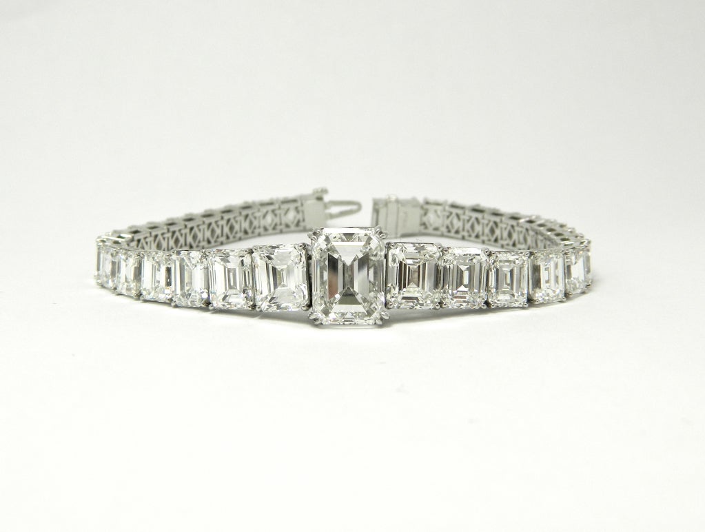 A stunning and elegant, graduated emerald cut diamond bracelet, consisting of 37 GIA certified emerald cut diamonds totaling 32.26cttw.  The diamonds range in size from a 5.01ct F VS2 to a .47ct E VS2, in color from D-G, and in clarity from VVS1-VS2