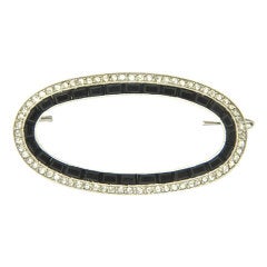 CARTIER PARIS, Diamond, Onyx, and Platinum Brooch