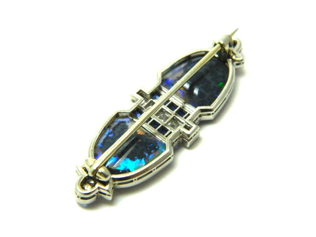 A Stunning and unique, Art Deco, platinum, diamond, sapphire and black opal brooch by Gillot & Co.