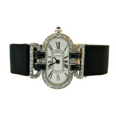 Cartier Lady's Platinum, Diamond and Onyx Art Deco Wristwatch