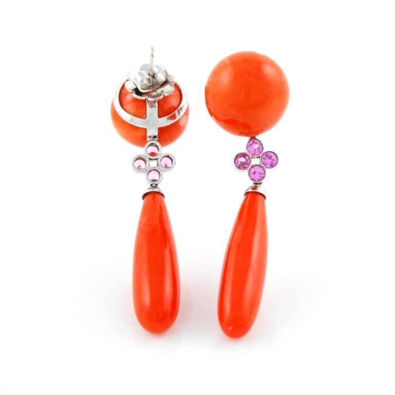 Beautiful pair of dangle earrings in 18kt white gold featuring 1.66 carats of pink sapphires and 28.00 grams of Japanese Coral. Realized in Italy by Paolo Piovan.