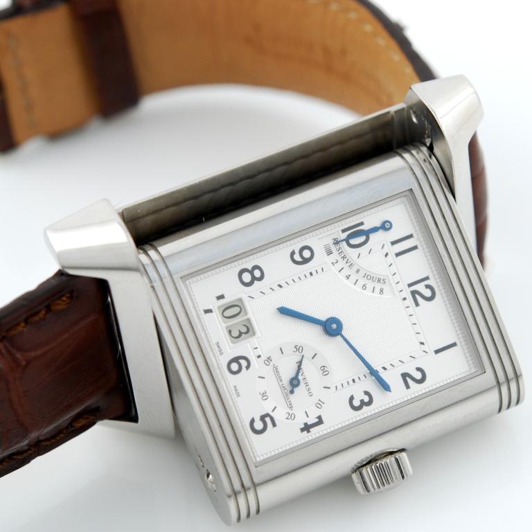 Jaeger-LeCoultre Reverso Grande Date wristwatch, Ref. 240.8.15. Reversible stainless steel case, sapphire crystal, silvered dial with Arabic numerals and baton hands. Leather brown strap with JLC original clasp. Manual winding with 8-day reserve,