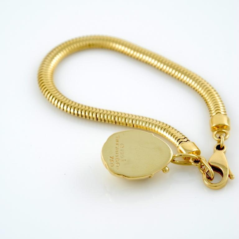 18kt yellow gold gaspipe bracelet with a scarab pendant, signed tiffany & Co. circa 1993.