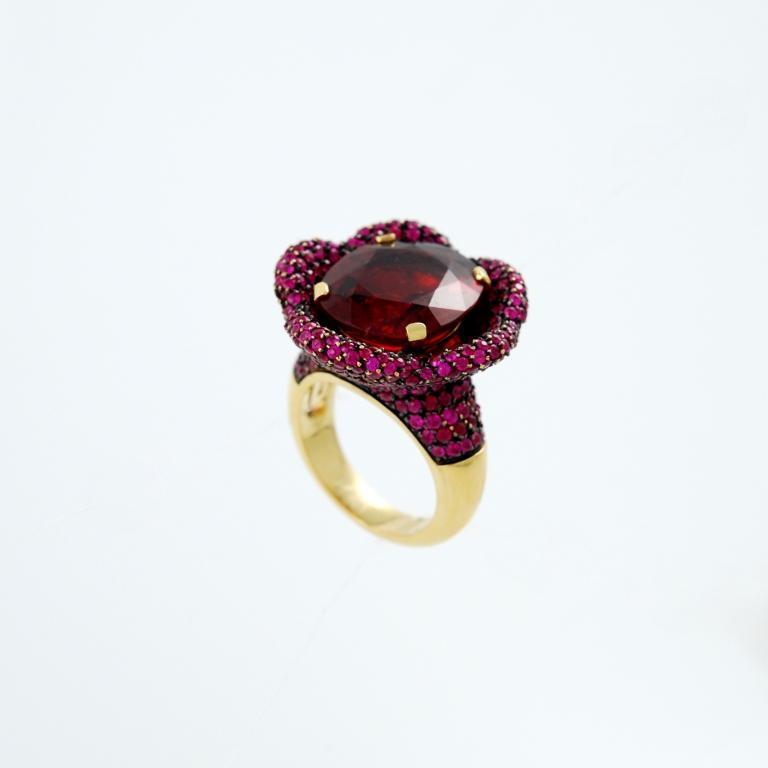 18kt yellow gold flower ring set with a natural red tourmaline weighing 12.76 carats and rubies for 7.10 carats. Made in Italy by Paolo Piovan.