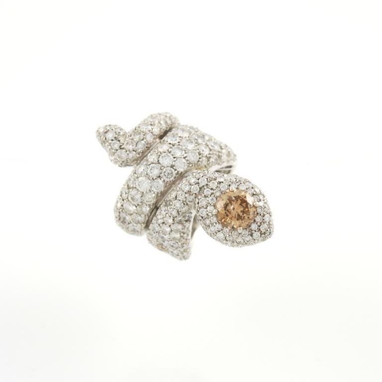 Paolo Piovan snake ring, featuring a single 2.02 carats brown diamond and 12.40 carats of colorless diamonds. Set in 18kt white gold, 1990's.
