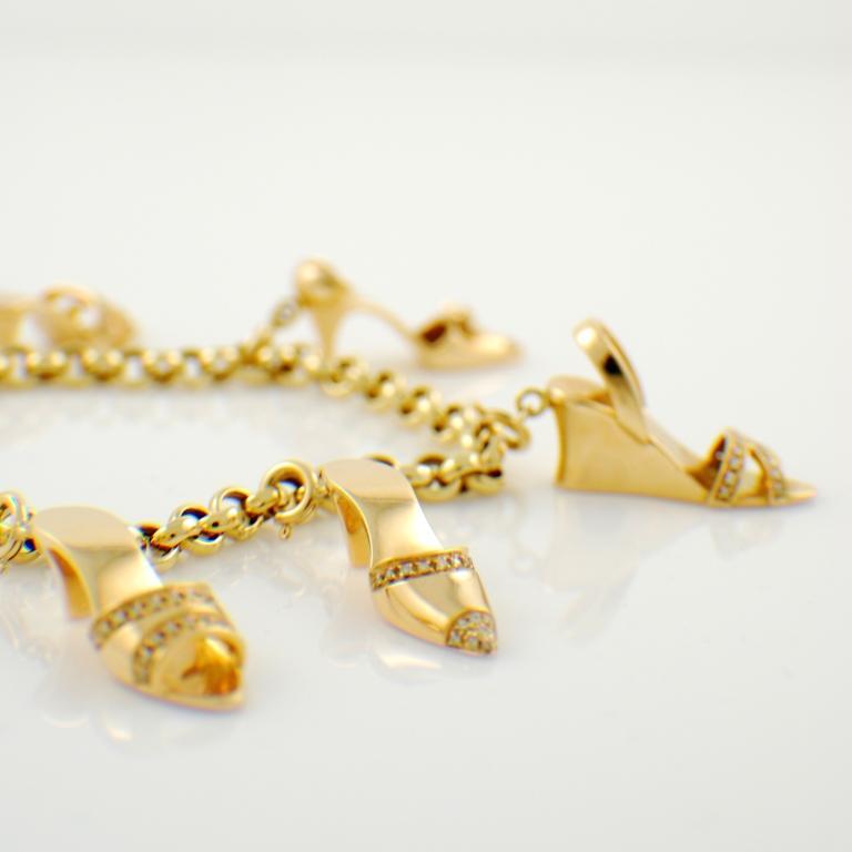18kt pink gold and diamond charm bracelet with five different shoe pendants. Made in Italy by Ottaviano.